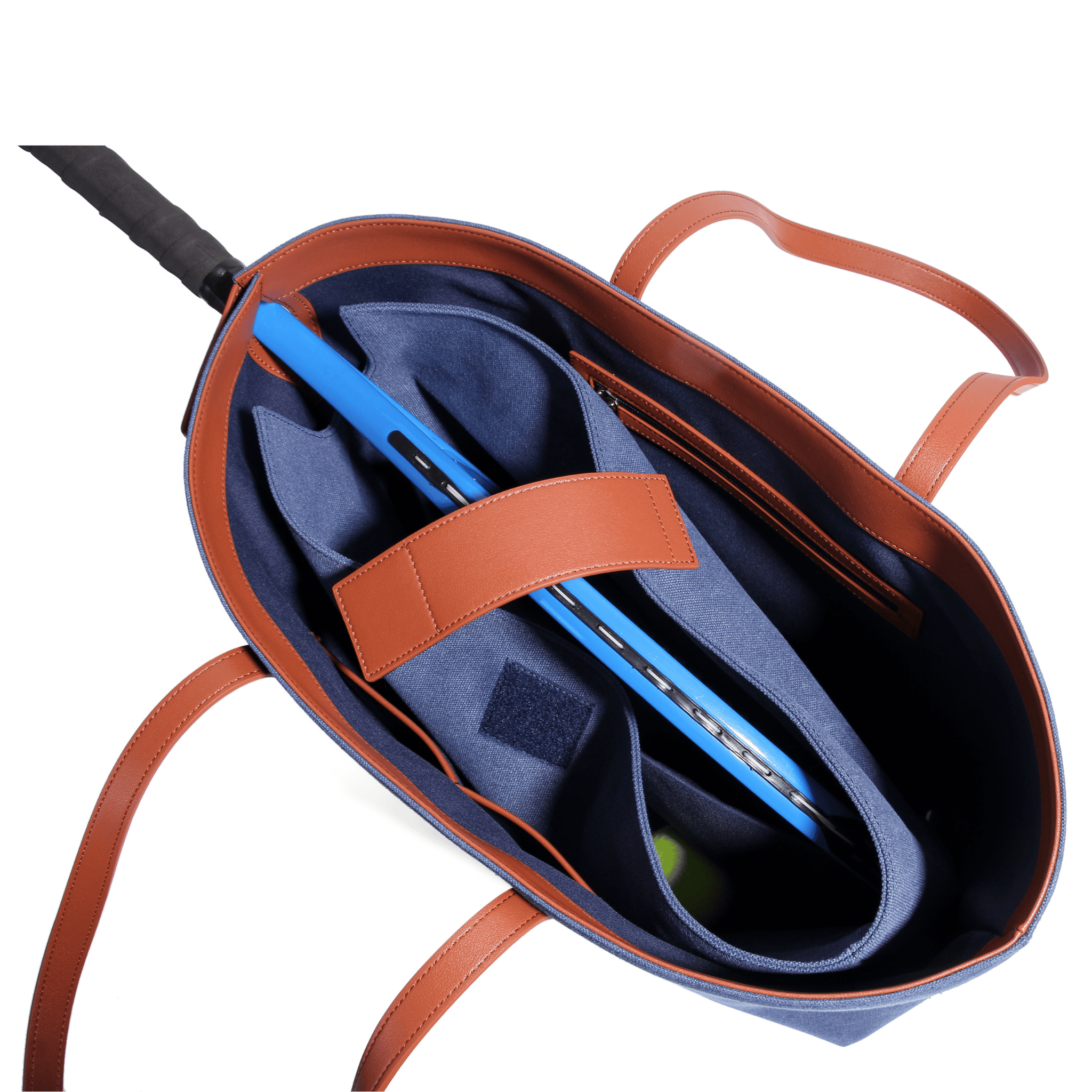 A blue and brown tennis racket tote with internal compartments and leather handles, seen from above. A tennis racket and ball are inside the bag, making this canvas leather court bag perfect for organizing your gear.