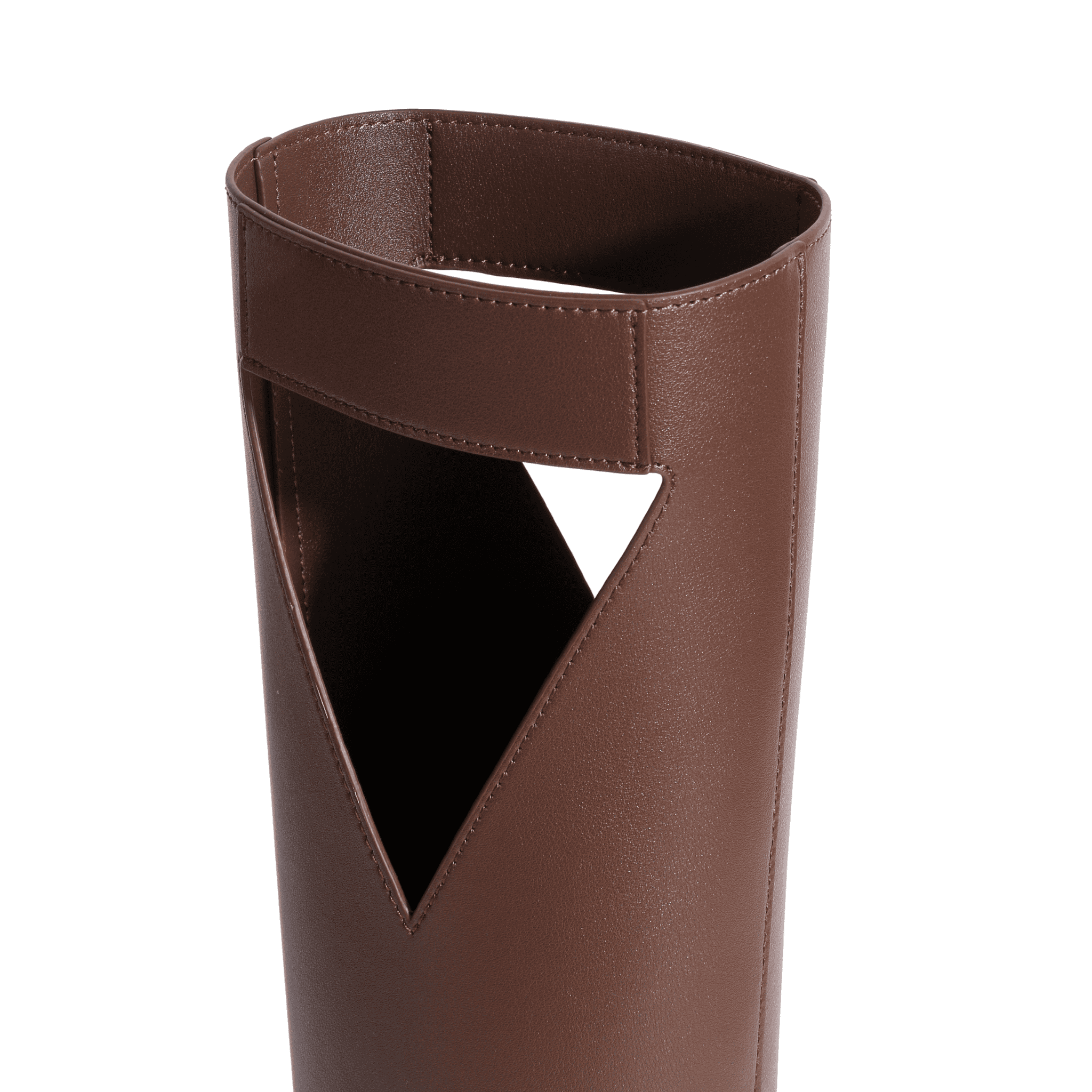 Close-up of the top part of a brown leather boot with a distinctive V-shaped cutout and a wide, folded-over edge, resembling the craftsmanship seen in a luxury leather wine bag.