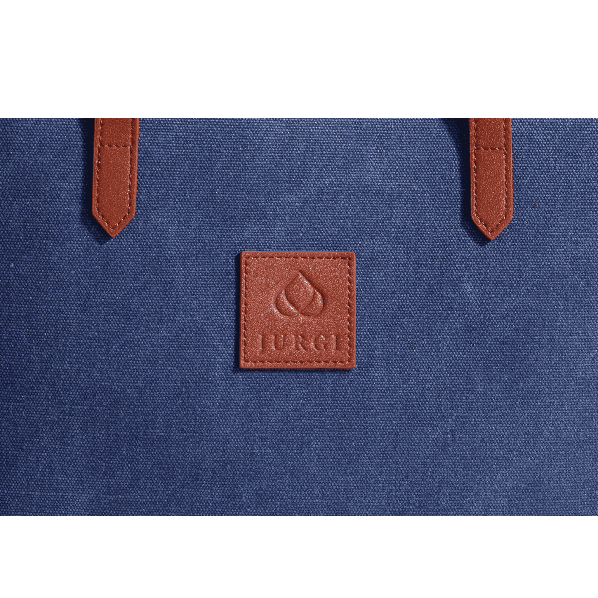 Close-up of a blue canvas leather court bag with brown leather handles and a square brown leather patch embossed with a droplet logo and the word JURGI.