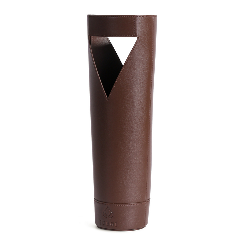 A brown, cylindrical leather wine bottle holder with a triangular cutout handle near the top and a small embossed logo near the base.
