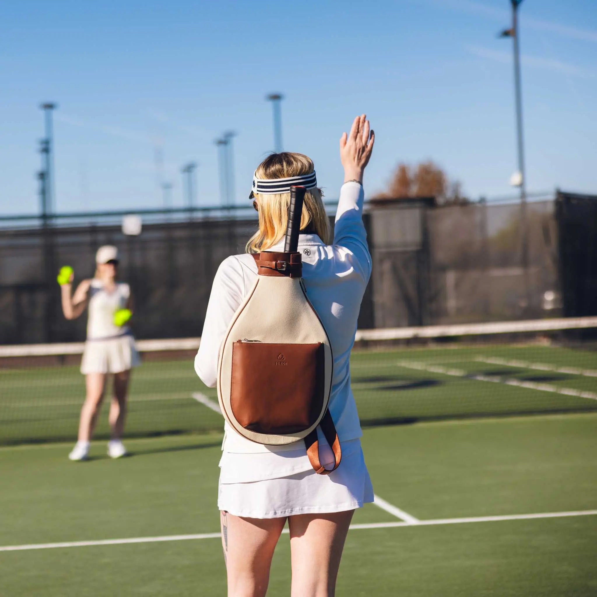 Brown leather and canvas tennis backpack