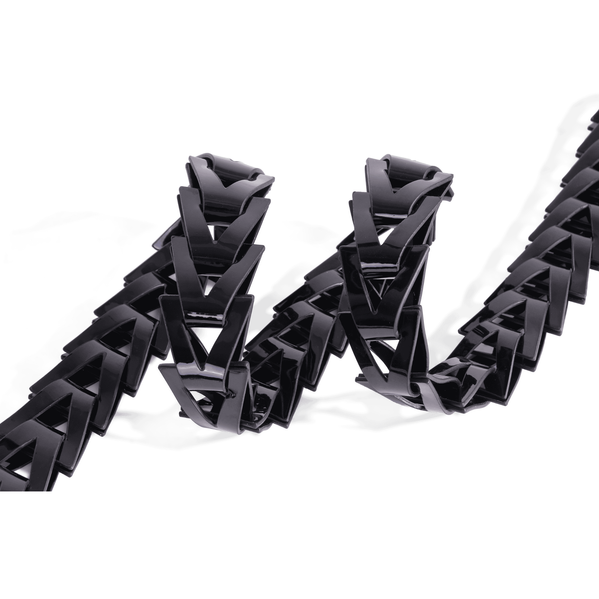 Luxury black belt with textured gold buckle and modern triangle pattern