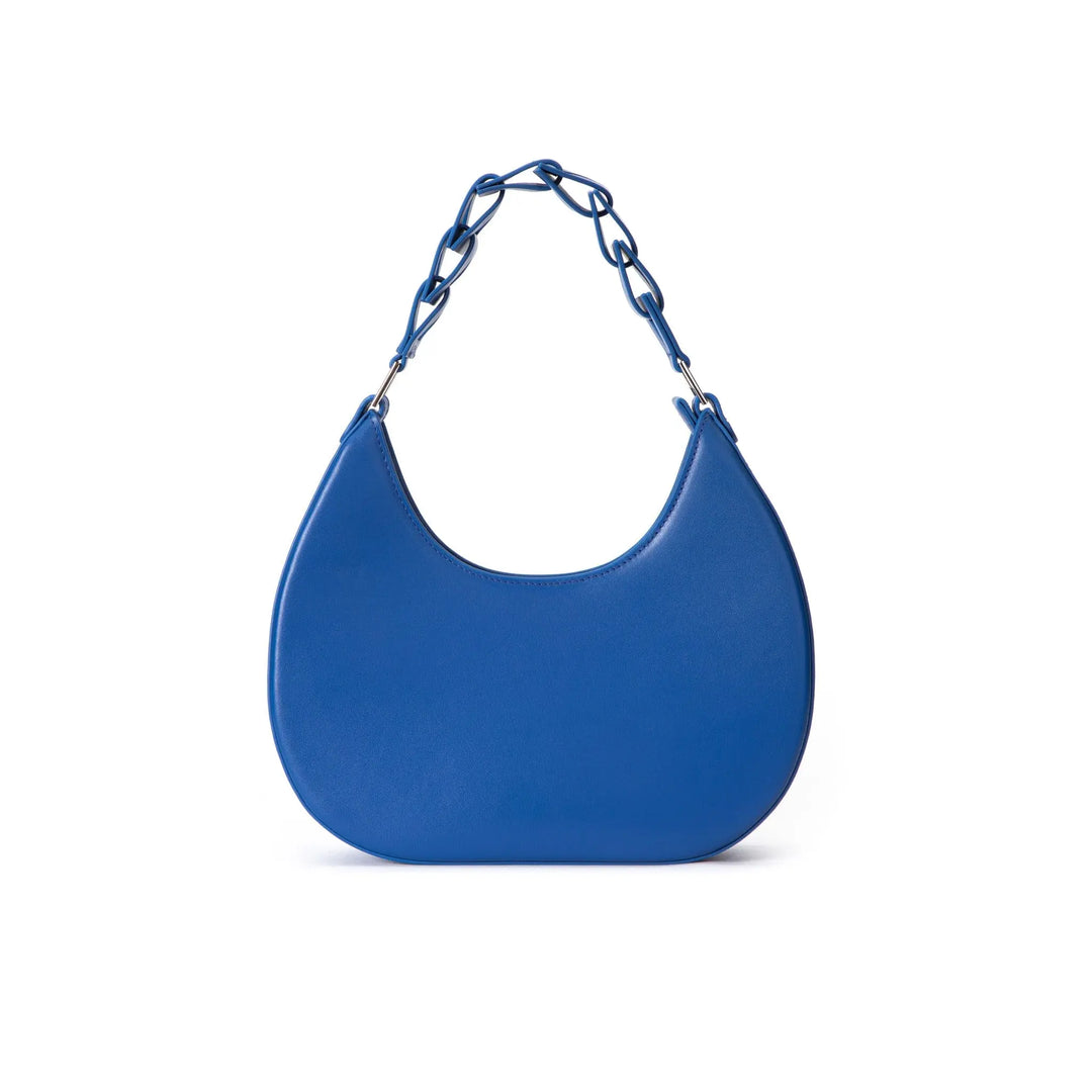 A blue leather handbag with a D-shape design