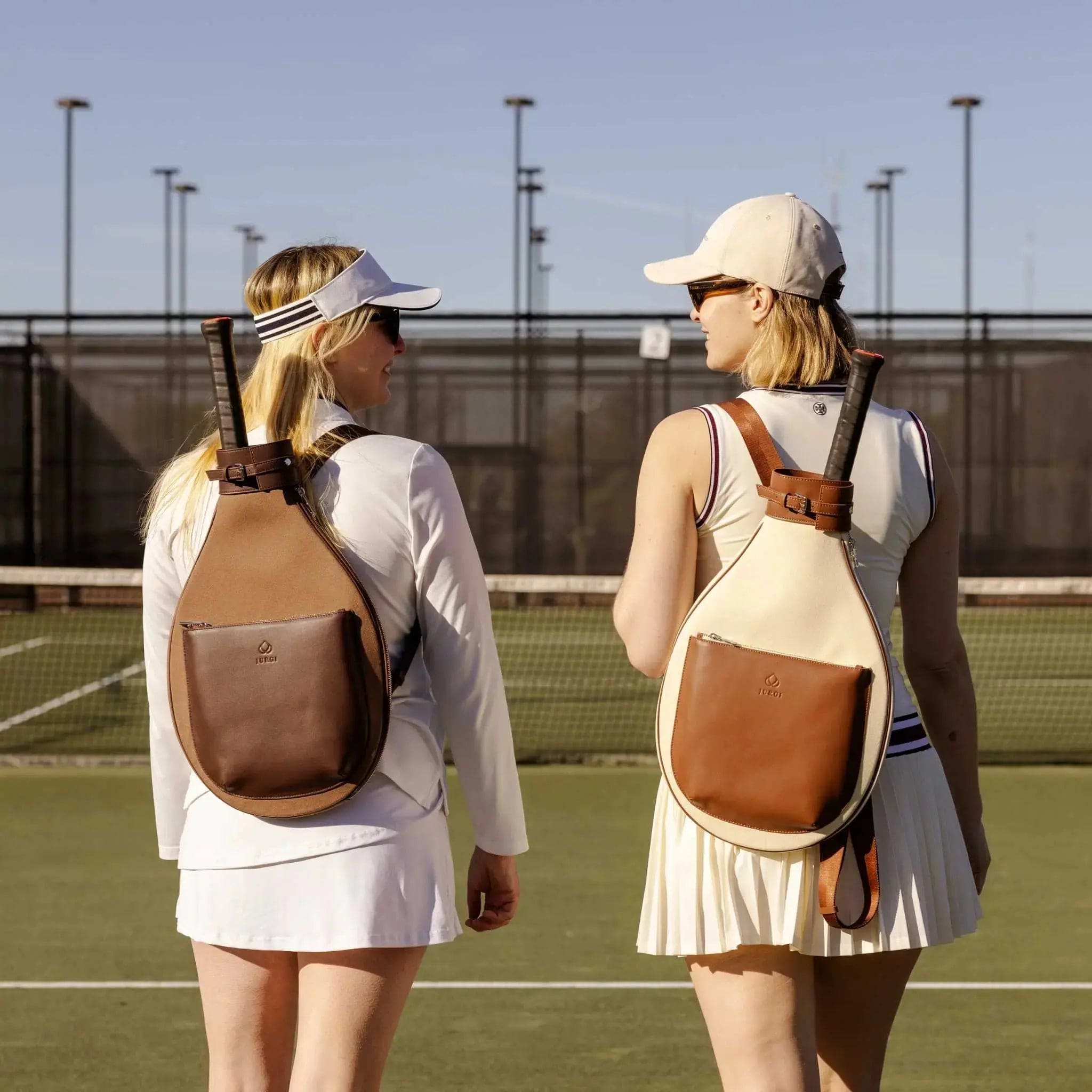 Brown leather and canvas tennis backpack with brown tennis bag