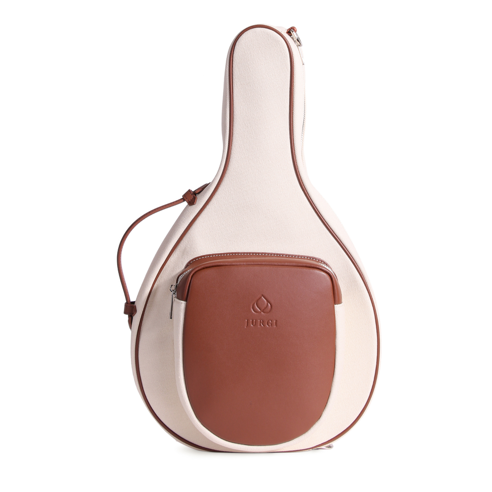 Natural padel bag with brown leather detailing and adjustable strap