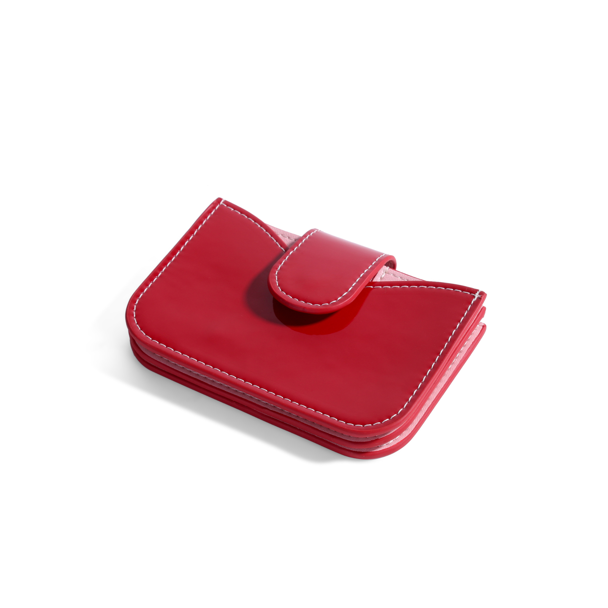 Red patent leather accordion wallet with white stitching and a snap closure tab.
