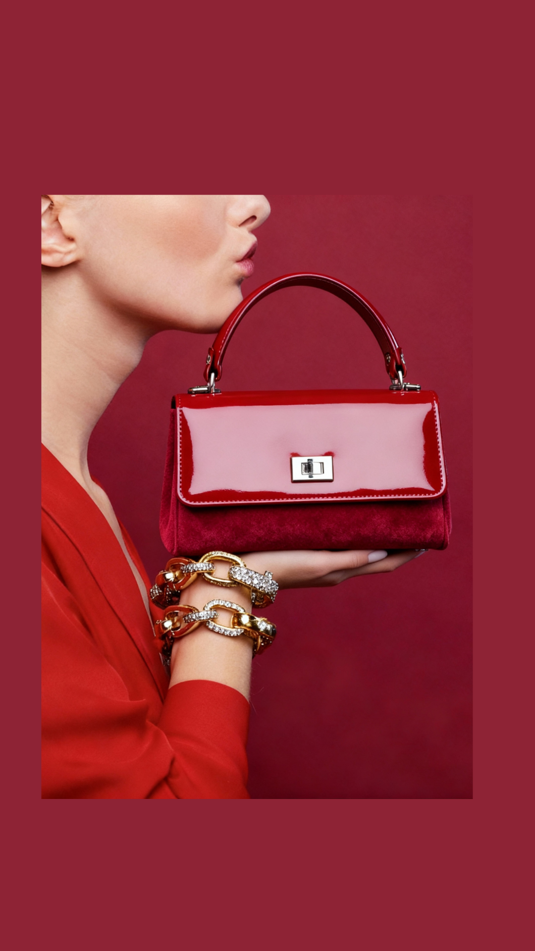 Red handbag held by a person against a red background