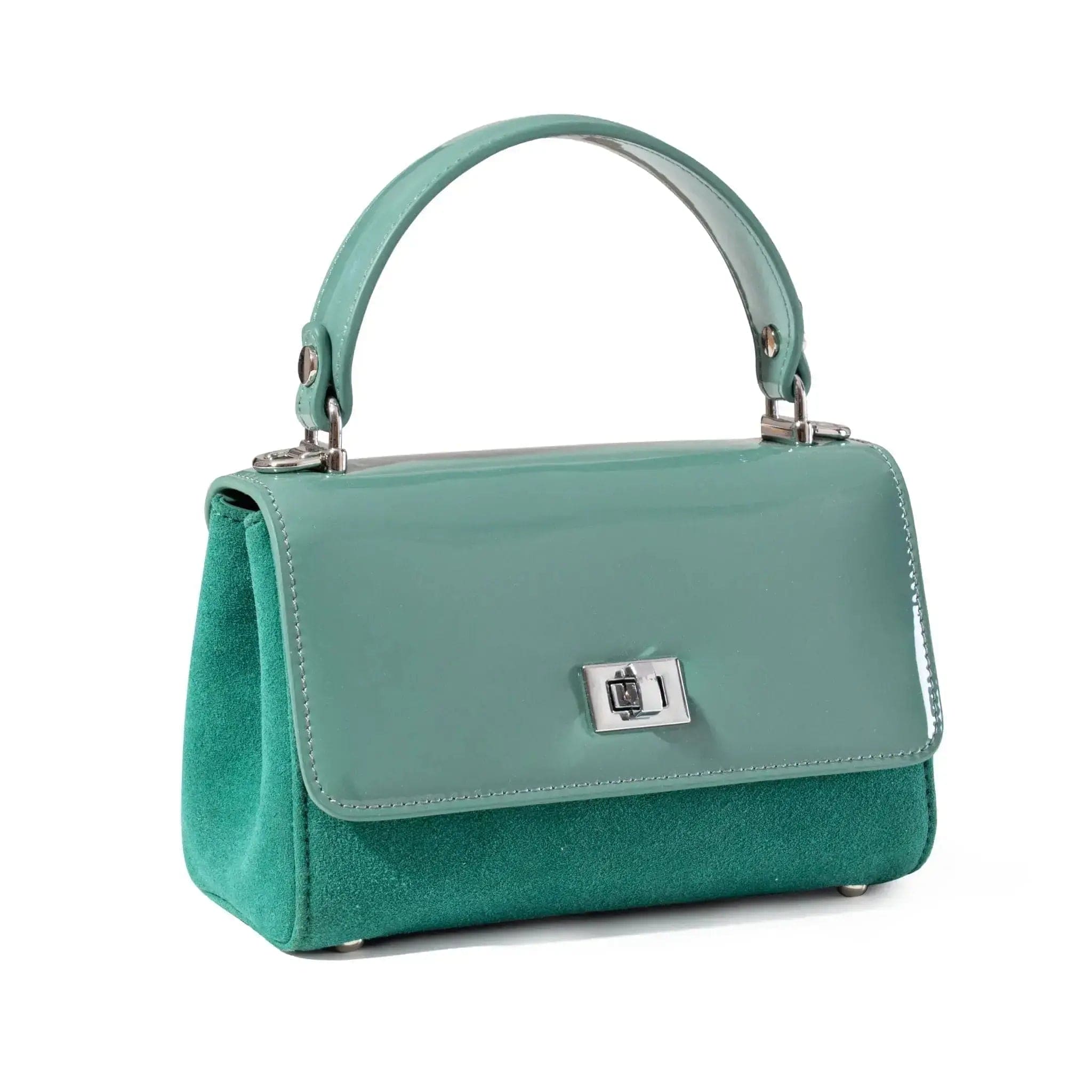 Mint handbag with a silver clasp on a white background from shiny leather and suede