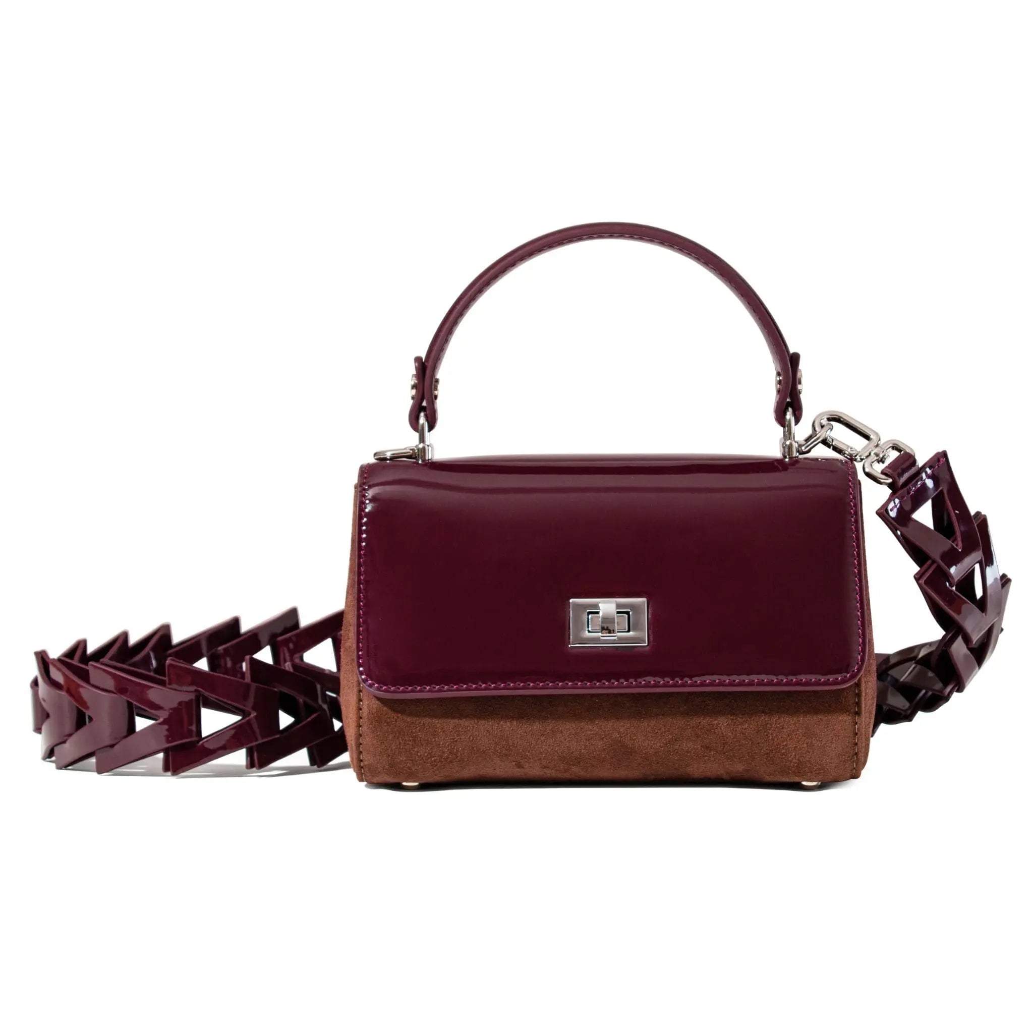 Burgundy patent leather handbag with a unique strap design 