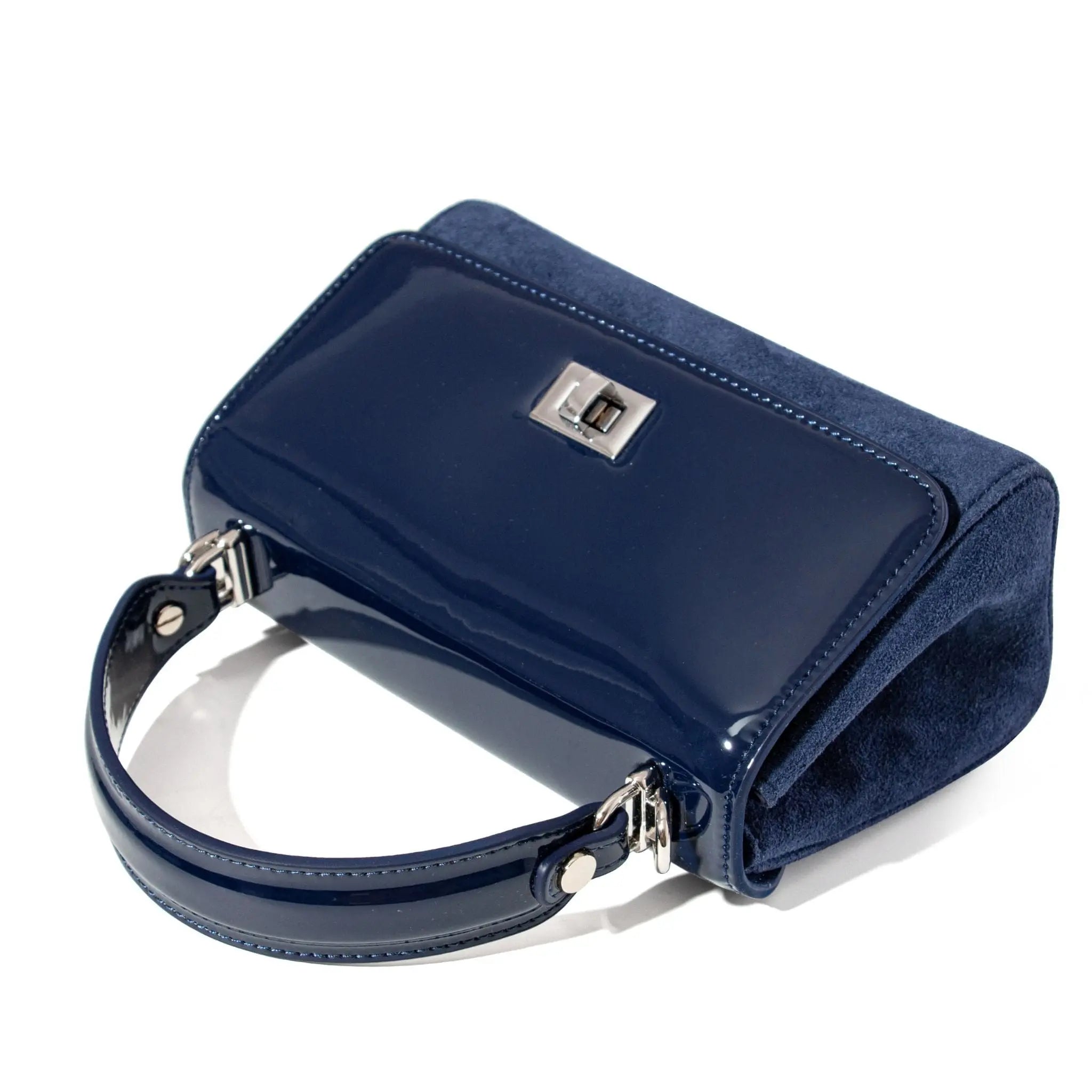 Blue handbag with a silver clasp on a white background
