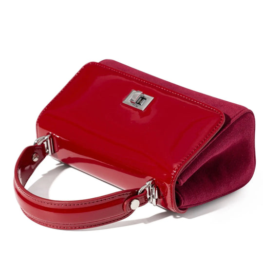 Red leather and suede handbag with a silver clasp 