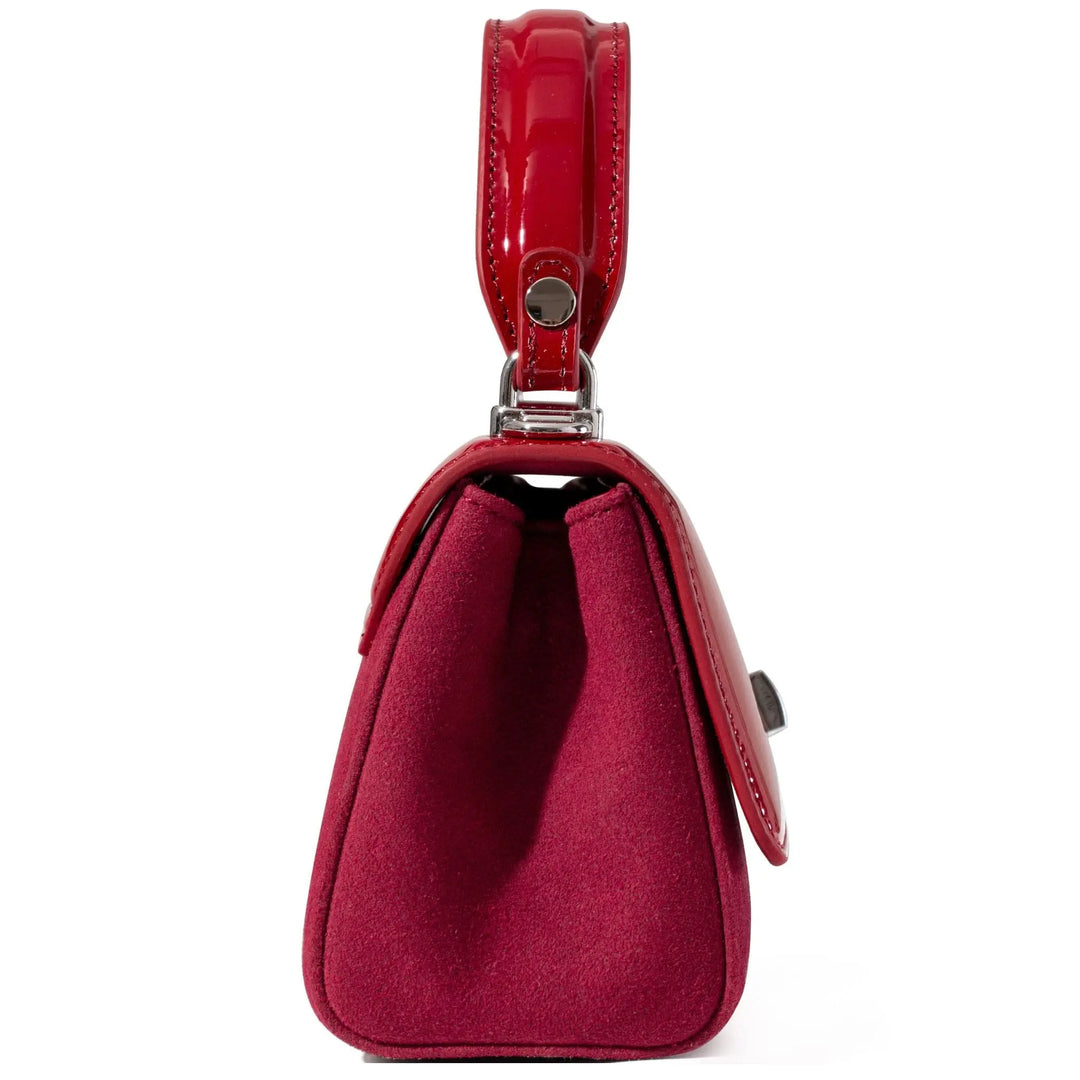 Red handbag with a strap from patent leather 