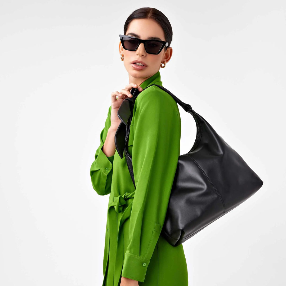 Designer black leather and suede tote with adjustable knotted handle