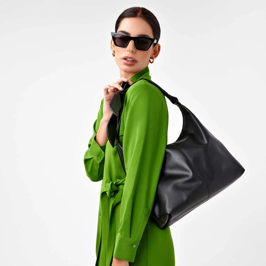 Designer black leather and suede tote with adjustable knotted handle