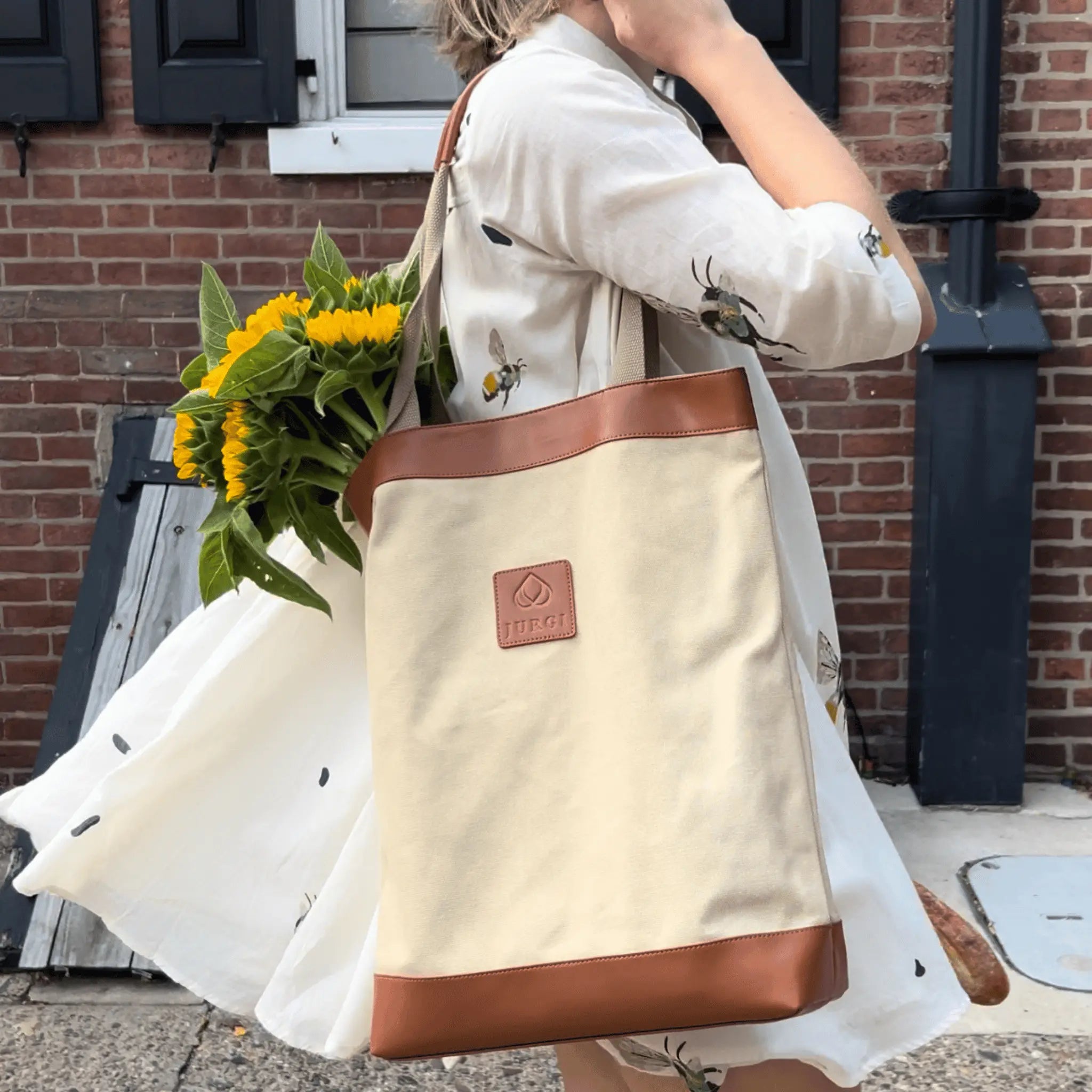 JURGI canvas carryall tote bag with brown leather trim, handcrafted design