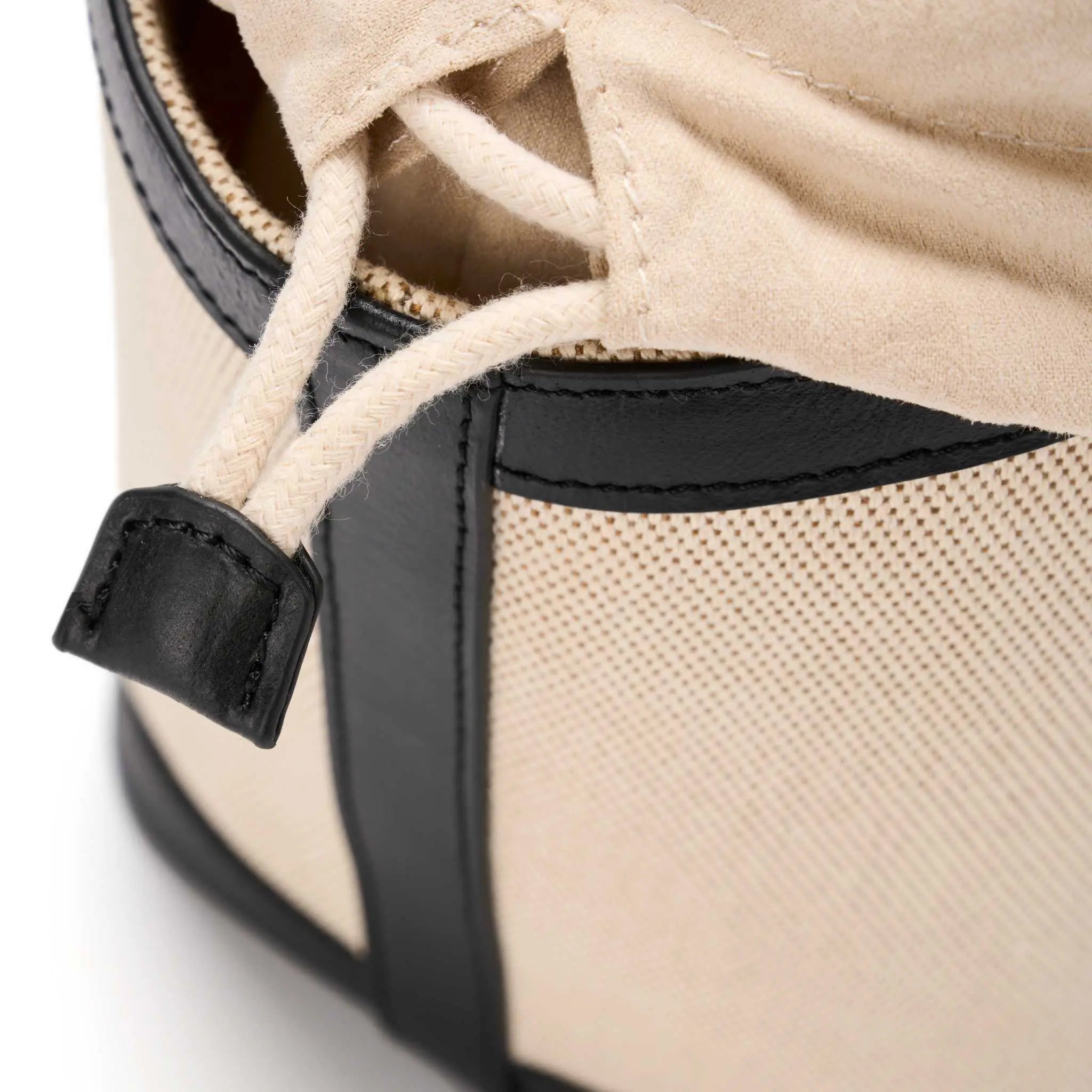 Neutral canvas handbag with elegant black leather straps by JURGI