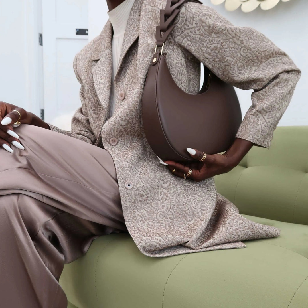 Luxury brown leather handbag, moon silhouette, designed by JURGI
