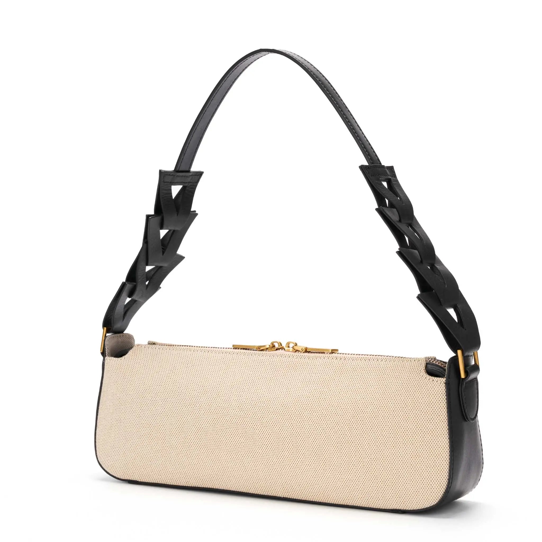 Handcrafted canvas handbag featuring black leather geometric details