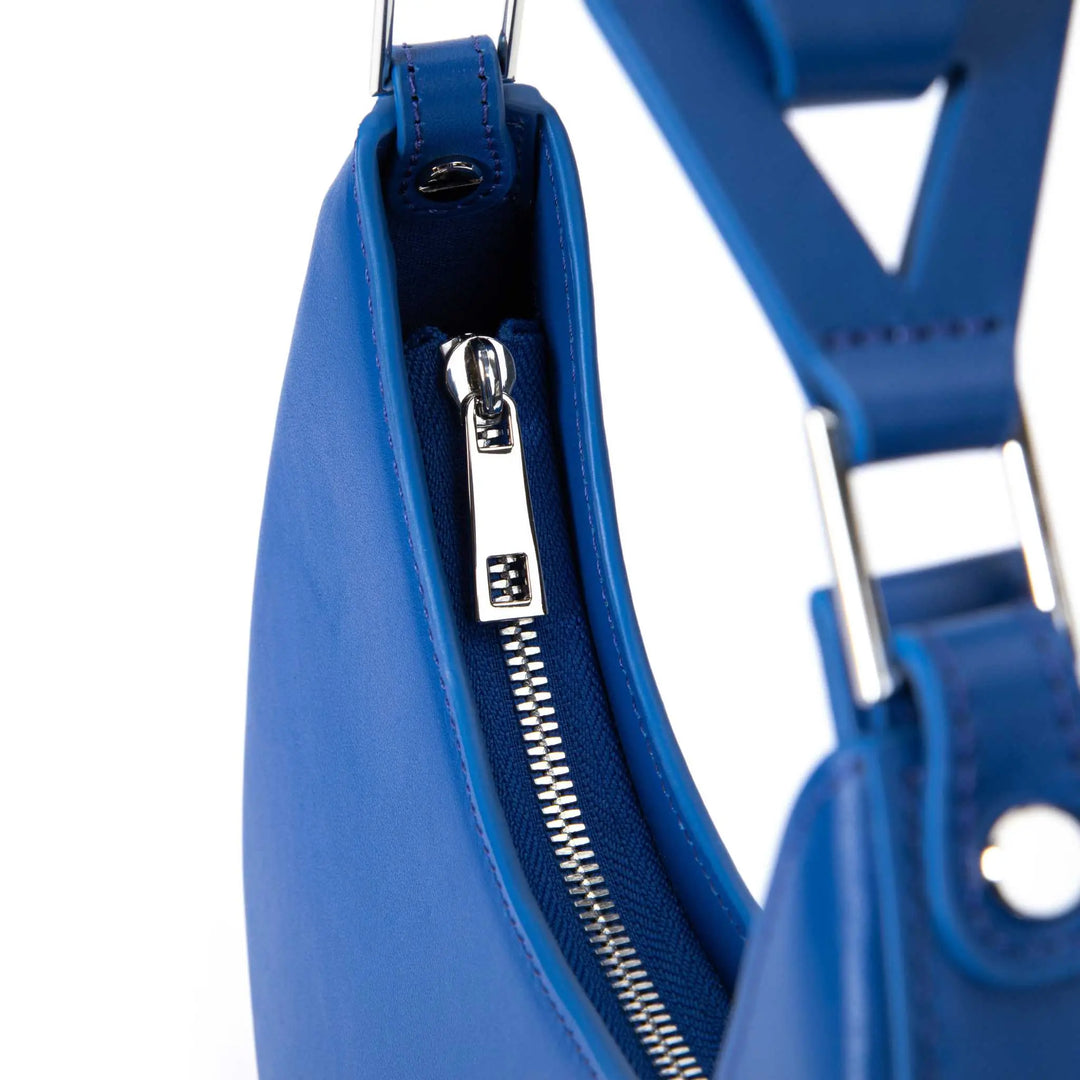Blue leather women’s handbag, stylish moon silhouette