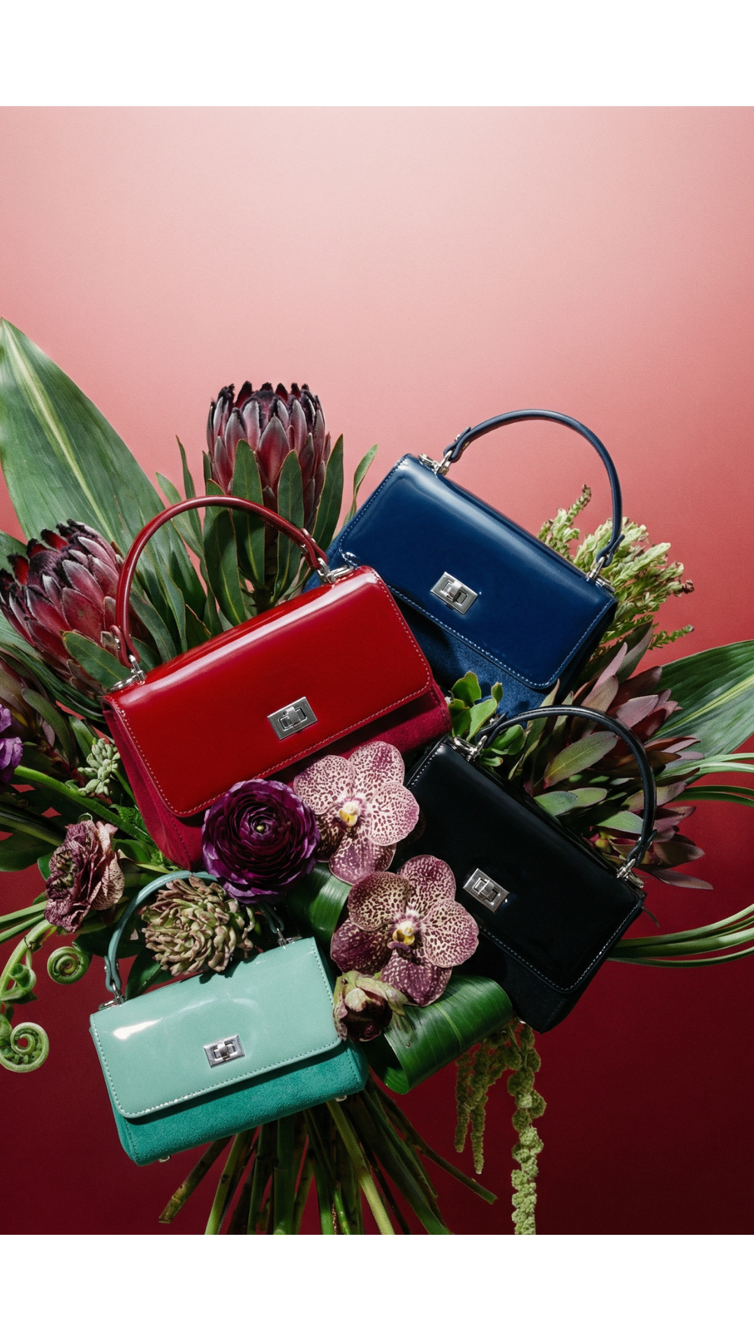 Four handbags in red, blue, black, and green surrounded by flowers on a red background